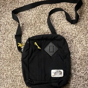 The North Face Black Messenger Bag with Yellow Accents